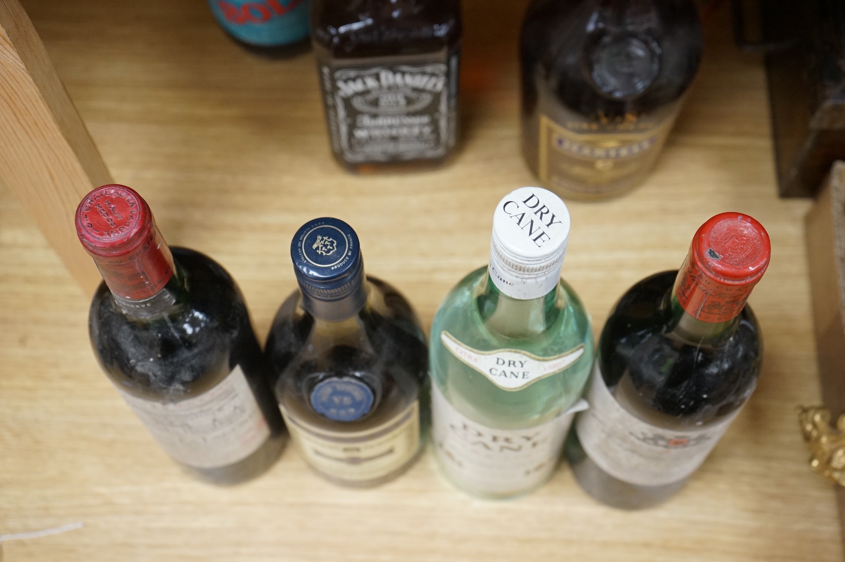 Two bottles of claret and five bottles of spirits to include Dry Cane Rum and Martel Cognac